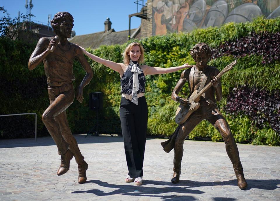 The bronze sculptures, created by sculptor Amy Goodman (centre), unveiled at One Bell Corner in Dartford (PA)