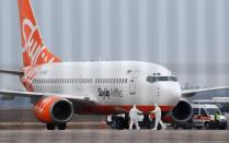 An aircraft transporting passengers from China is seen at an airport outside Kiev