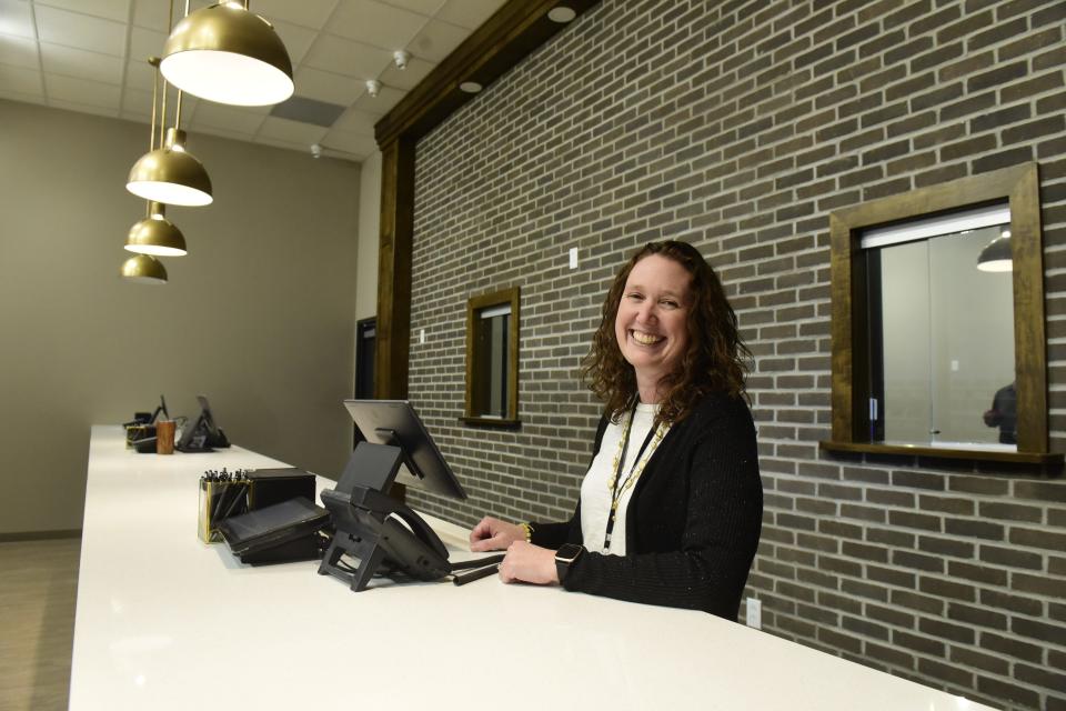 Michele Minehart stands behind of the counter of the Ohio Cannabis Company location she will manage in Wyandot County.