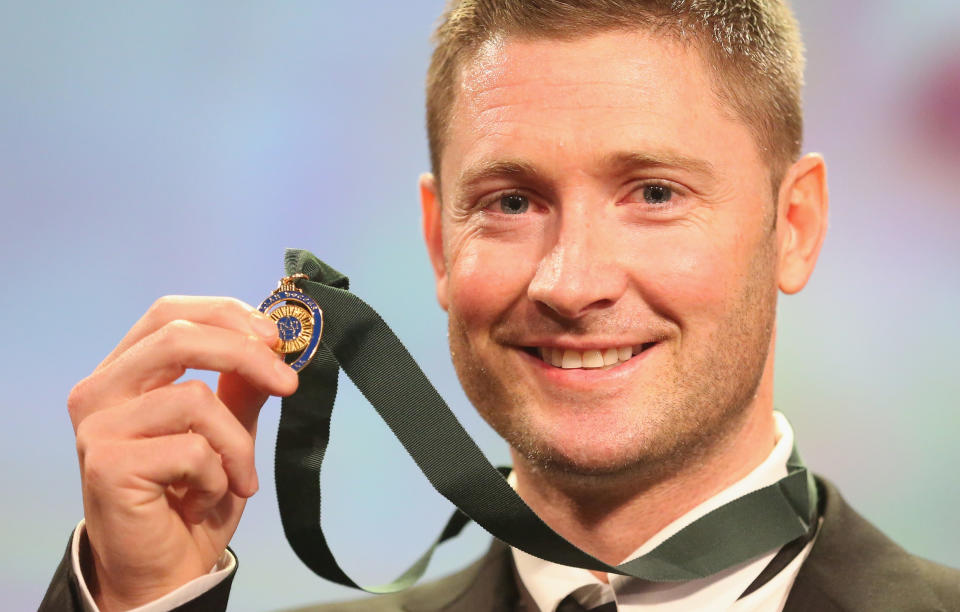 Seen here, Michael Clarke poses with his Allan Border Medal from 2013.