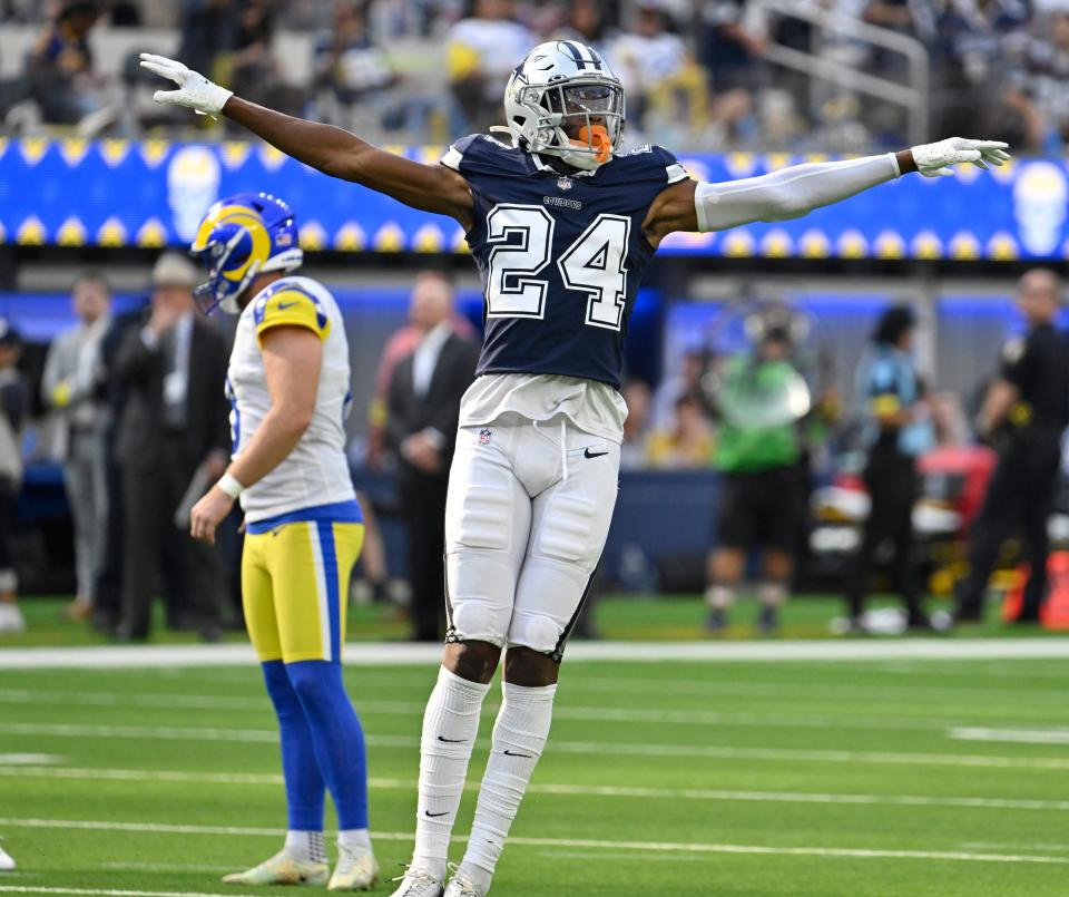 Dallas Cowboys safety Israel Mukuamu (24) signals a field goal attempt by Los Angeles Rams place kicker Matt Gay.