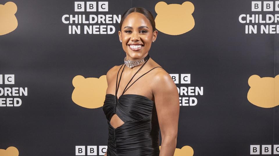 Alex Scott in black dress