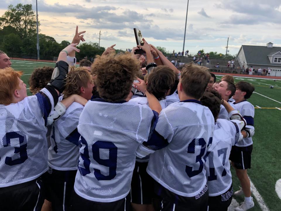 Rumson-Fair Haven boys lacrosse players celebrate with the NJSIAA Group 2 State Final trophy. Rumson-Fair Haven defeats Summit in the NJSIAA Group 2 State Final on June 3, 2022 at Rumson-Fair Haven Regional High School