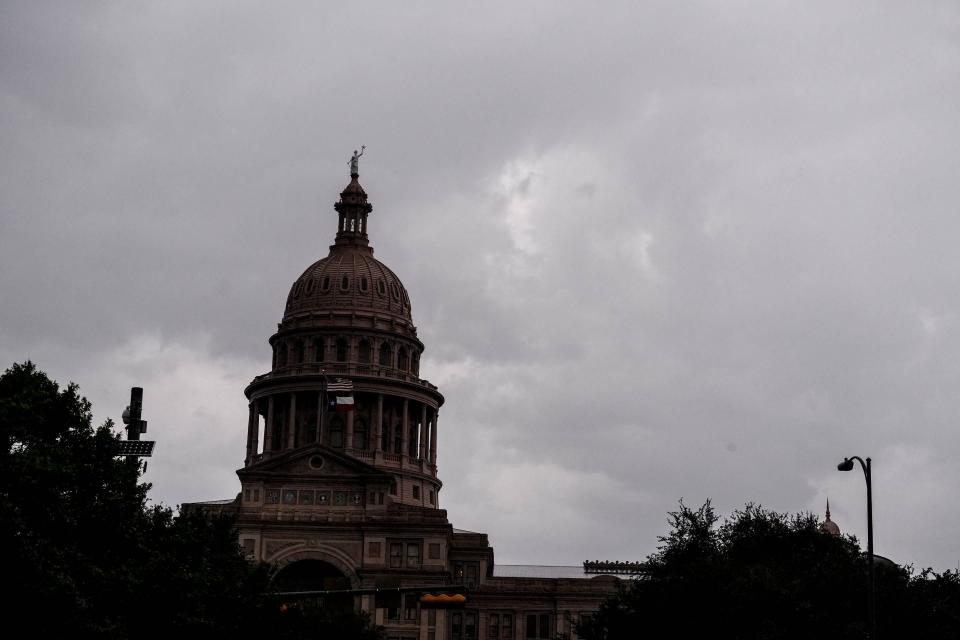 Storm clouds loom over the Texas Capitol Building in Austin, Texas on Aug. 18, 2022.