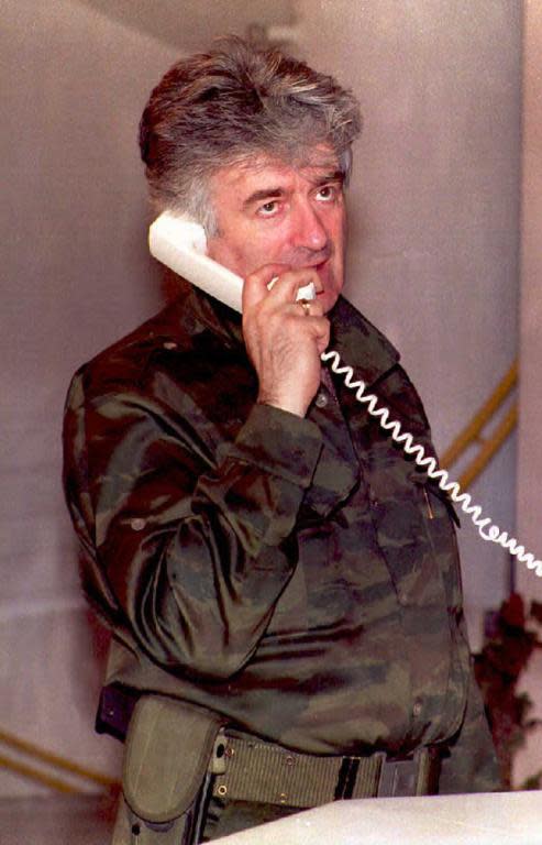A file photo taken in August 1995 shows Bosnian Serb leader Radovan Karadzic talking on the phone about the latest developments in Banja Luka