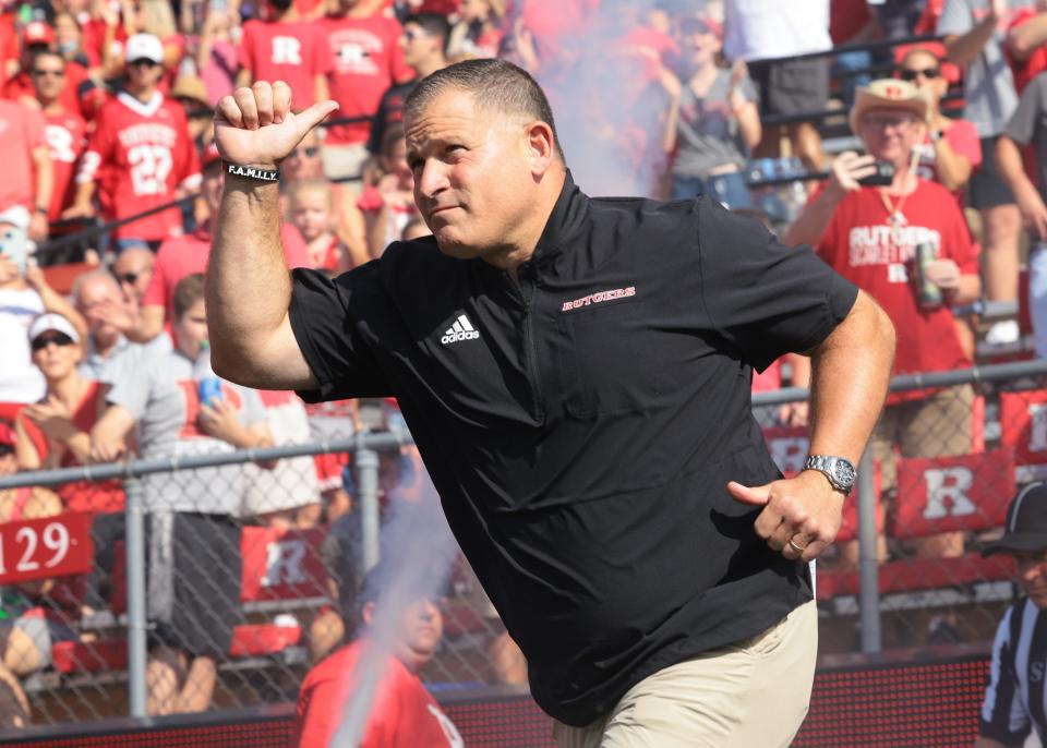 Sep 18, 2021; Piscataway, New Jersey, USA; Rutgers Scarlet Knights head coach Greg Schiano runs onto the field before the game against the Delaware Fightin Blue Hens at SHI Stadium. Mandatory Credit: Vincent Carchietta-USA TODAY Sports