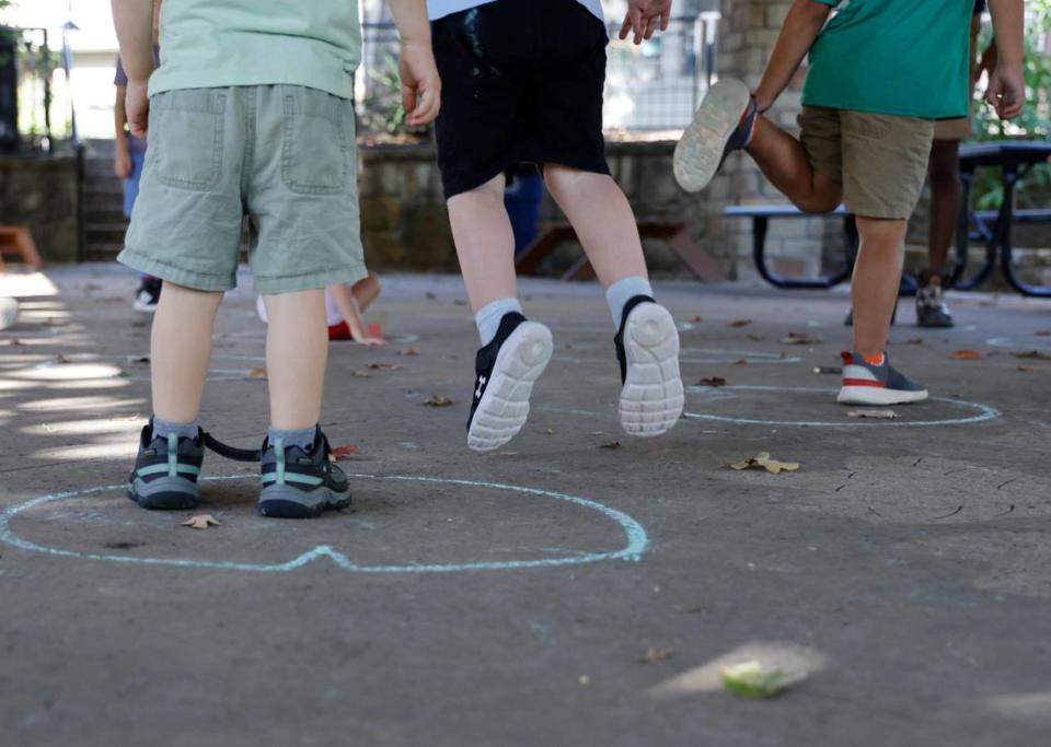 As children learned about the life cycle of a frog they played a game at Cross Timbers Forest Preschool at the Bob Jones Nature Center and Preserve in Southlake on Friday, Sept. 22, 2023. The game was much like musical chairs except they hopped and danced around lily pads drawn on the concrete.