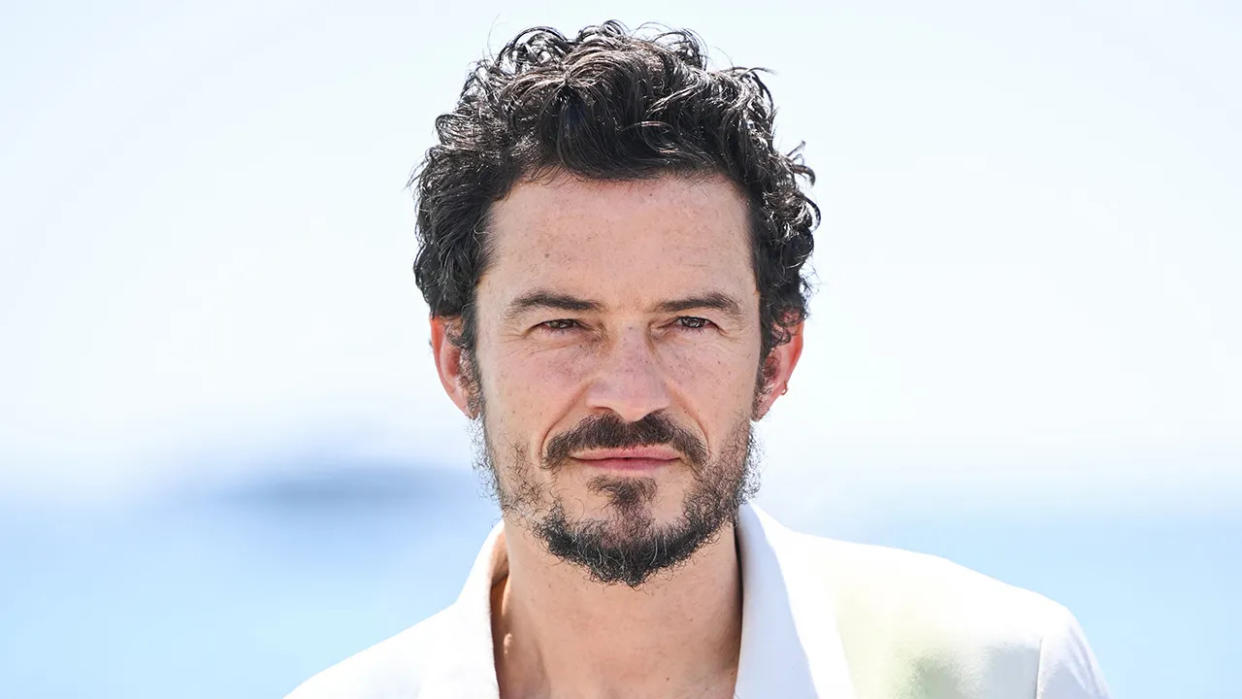 Orlando Bloom in a white jacket in Cannes