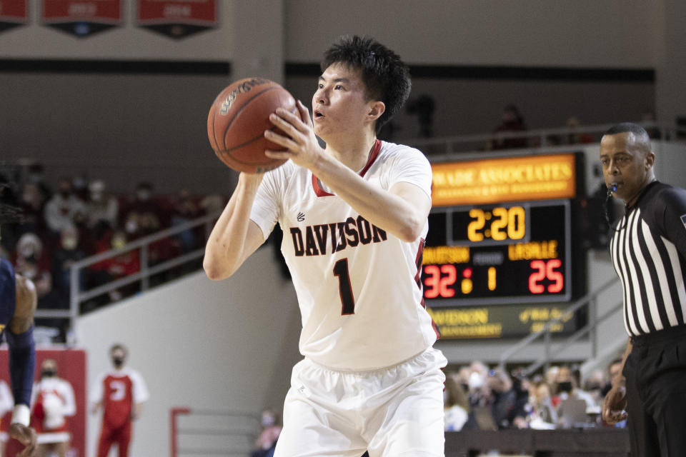 Davidson guard Hyunjung Lee (1) prepares to take a jump shot during the first half of an NCAA college basketball game against LaSalle on Saturday, Jan. 29, 2022, in Davidson, N.C. (AP Photo/Brian Westerholt)