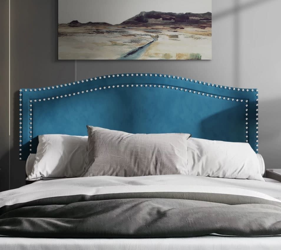 teal with nail head trim headboard