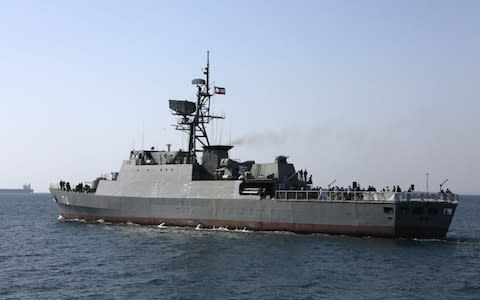 An Iranian Navy warship takes part in the "National Persian Gulf day" in the Strait of Hormuz - Credit: ATTA KENARE / AFP