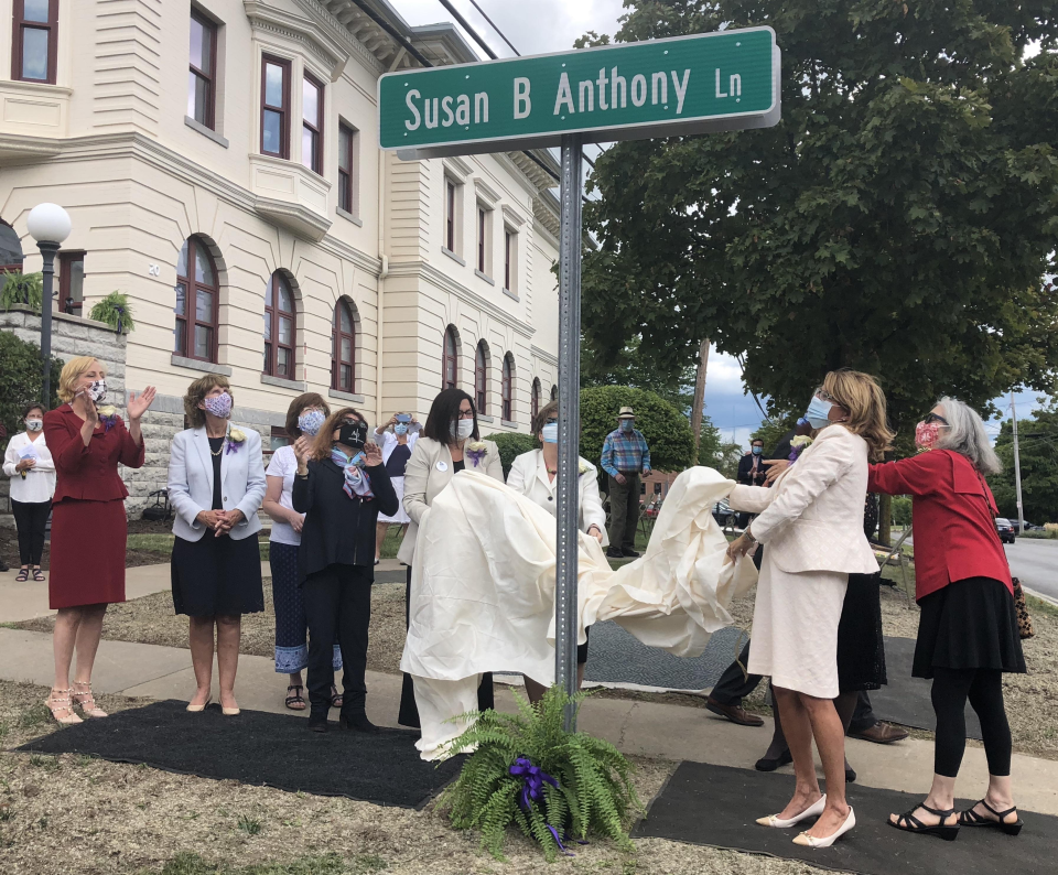 A street sign bearing the name Susan B. Anthony Lane is unveiled Tuesday outside the Ontario County Courthouse where famed Rochester suffragist Susan B. Anthony was tried and convicted for voting.