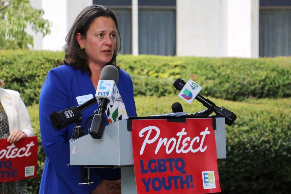 Liz Barber, of the American Civil Liberties Union of North Carolina, speaks at a news conference, Wednesday, Aug. 16, 2023, outside the Legislative Building in Raleigh, N.C. The state legislature's Republican supermajority will attempt later Wednesday to override the Democratic governor's veto of a gender-affirming care ban for minors.