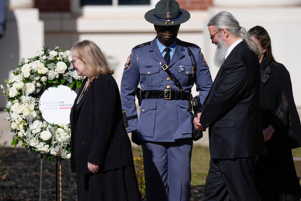 Amy Carter and her husband James Wentzel participate in a wreath laying ceremony at the Rosalynn Carter Health & Human Services at Georgia Southwestern State University (AP)