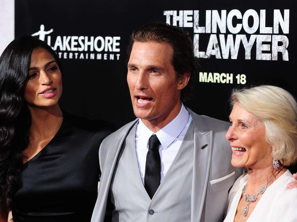 Camila Alves with Matthew McConaughey and his mother Kay McConaughey. The Lincoln Lawyer premiere held at the ArcLight Cinemas Cinerama Dome. 10 March 2011, Hollywood, CA. Photo Credit: Giulio Marcocchi/Sipa Press./LincolnLawyer_gm.106/1103110811