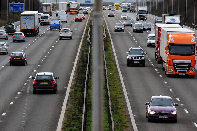 File photo dated 07/01/14 of vehicles travelling along a motorway. One in nine (11\%) vehicles on UK motorways drift out of their lanes, according to new research.