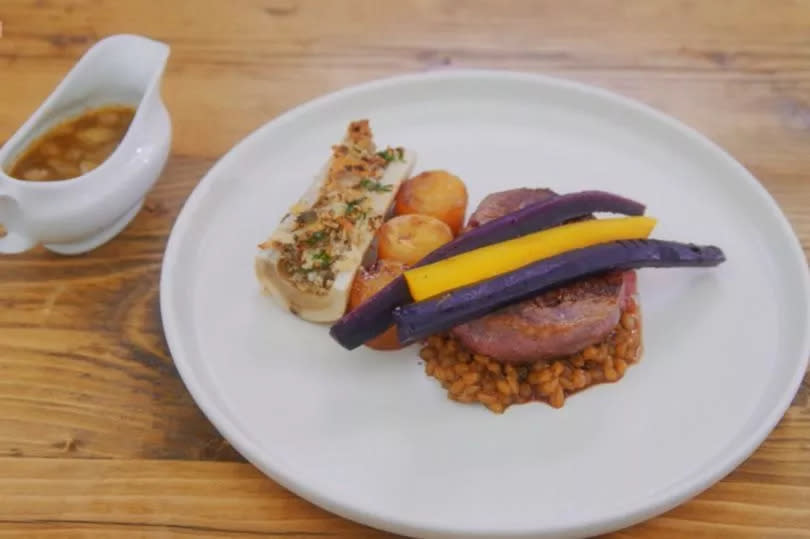 Louise's 'deconstructed lobby' consisted of pan-fried fillet steak on malt beer pearl barley, topped with salt-baked carrots and served with fondant swede, bone marrow with a parsley and thyme crumb and a bone marrow sauce. -Credit:BBC