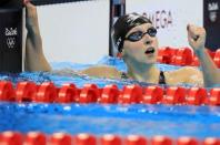 Katie Ledecky reacts after winning the gold and settng a new world record. REUTERS/Dominic Ebenbichler