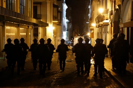 Police clash with demonstrators during a protest calling for the resignation of Governor Ricardo Rossello in San Juan
