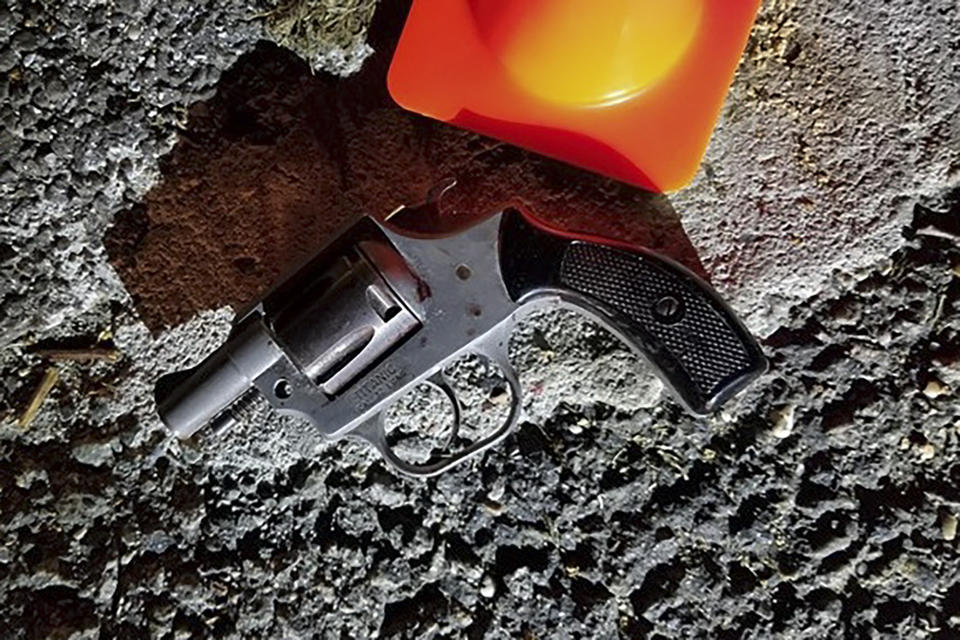 In this photo provided by the New York City Police Department, a hand gun recovered at the scene of a shooting sits on the pavement in the area where New York City police officer Brian Mulkeen was shot and killed early in the morning Sunday, Sept. 29, 2019, in the Bronx borough of New York. Mulkeen and his partner tried to apprehend a man who had fled questioning, and a struggle on the ground ensued. Mulkeen was struck by multiple bullets. (NYPD via AP)