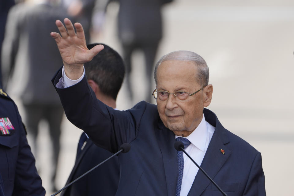 Lebanese President Michel Aoun waves for his supporters during a speech to his supporters gathered outside the presidential palace in Baabda, east of Beirut, Lebanon, Sunday, Oct. 30, 2022. Aoun left Lebanon's presidential palace Sunday marking the end of his six-year term without a replacement, leaving the small nation in a political vacuum that is likely to worsen its historic economic meltdown. (AP Photo/Bilal Hussein)