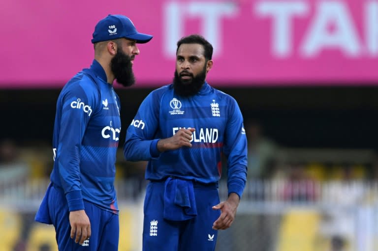 Key men: England's Adil Rashid (right) speaks with teammate Moeen Ali on Monday (Biju BORO)