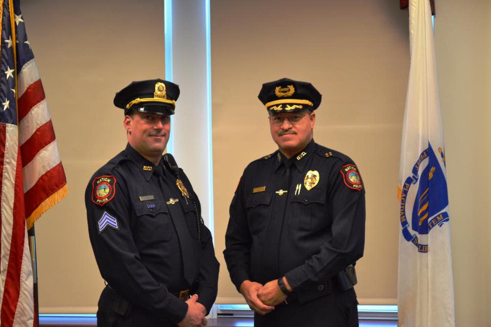 Natick police Sgt. James Quilty, left, pleaded guilty on Monday to three counts of indecent assault and battery in regards to a 2020 incident involving a female dispatcher. He is pictured here in 2016 with Natick Police Chief James Hicks.