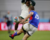 Namibia's Johan Tromp kicks the ball during the Rugby World Cup Pool B game at the City of Toyota Stadium between South Africa and Namibia in Toyota City, Japan, Saturday, Sept. 28, 2019. (AP Photo/Christophe Ena)