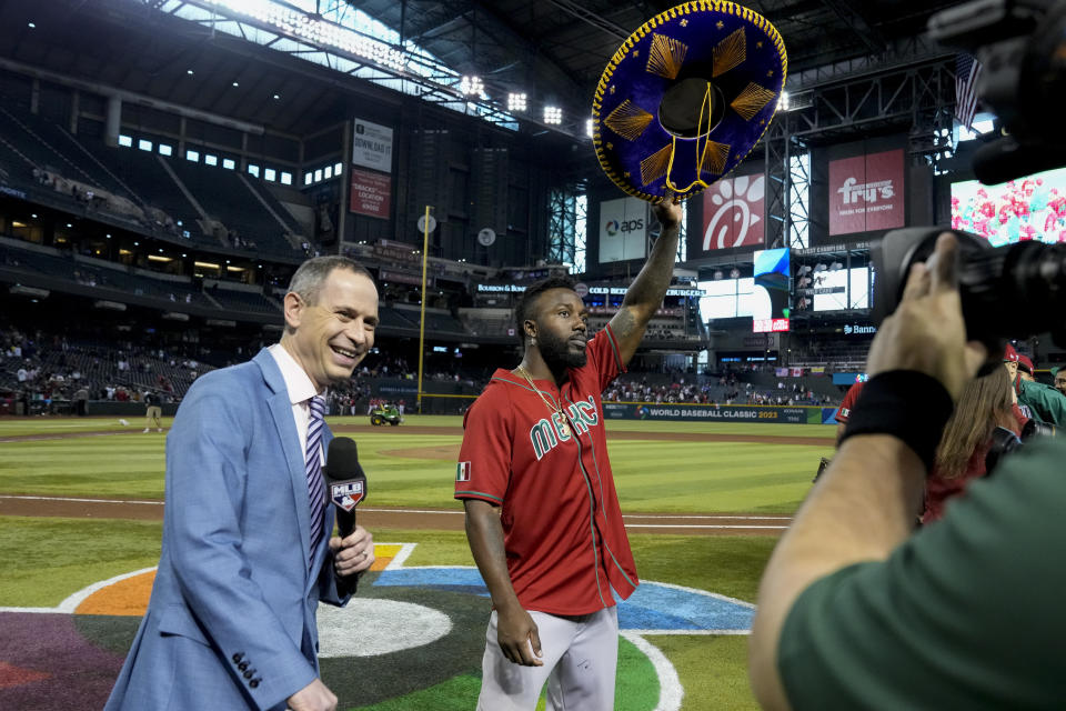 Mexico's Randy Arozarena, middle, celebrates after the team's 10-3 victory over Canada in a World Baseball Classic game in Phoenix, Wednesday, March 15, 2023. Mexico advances to the quarterfinals with the win. (AP Photo/Godofredo A. Vásquez)