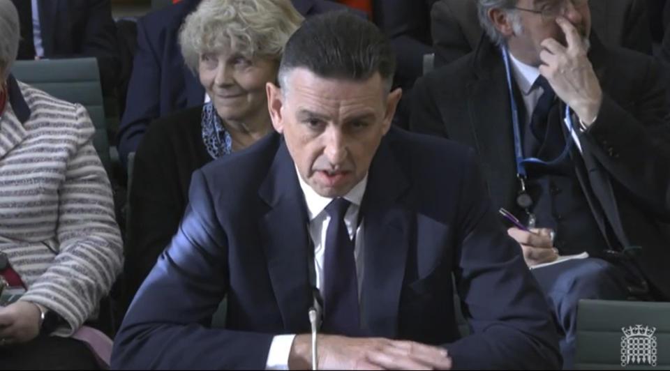 In this image taken from video made available by House of Commons, Paul Patterson, director of Fujitsu Services Ltd, gives evidence to the Business and Trade Committee at the Houses of Parliament, London, Tuesday Jan. 16, 2024. (House of Commons via AP)