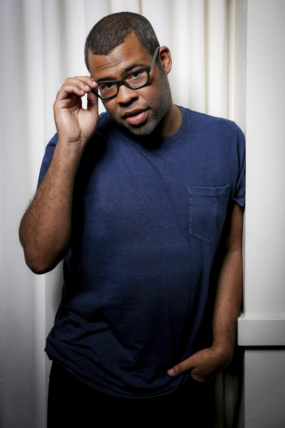 In this Thursday, Feb. 9, 2017 photo, Jordan Peele poses for a portrait at the SLS Hotel in Los Angeles. Peele's directorial debut, “Get Out,” in theaters Friday, Feb. 24, is one of those rare creations that functions both as a taut psychological thriller and as searing social commentary about racism in the modern era. (Photo by Rich Fury/Invision/AP)