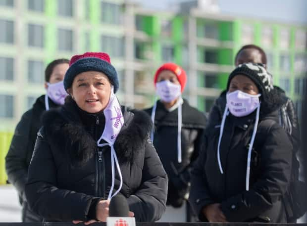 Gaëlle Fedida of l'Alliance MH2 speaks during a news conference in Montreal, highlighting the lack of second-stage housing and its effect on women and children who are victims of domestic violence. 