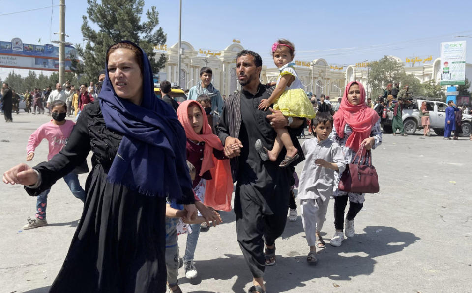 Thousands of Afghans rush to the airport in Kabul