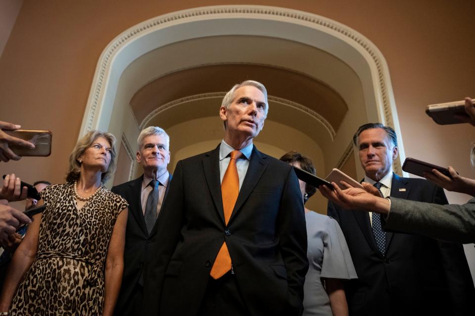 The lead GOP negotiators on the bipartisan infrastructure legislation, Sens. Lisa Murkowski, Bill Cassidy, Rob Portman, Susan Collins and Mitt Romney, speak to reporters Wednesday after meeting privately with Senate Minority Leader Mitch McConnell.