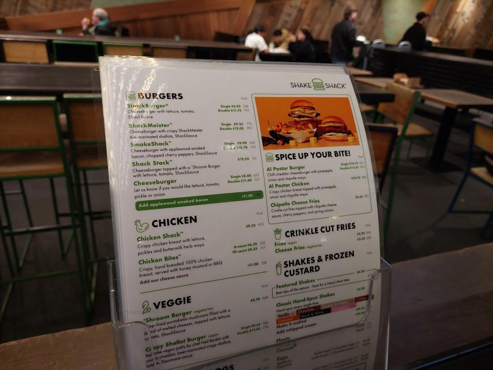 Physical menus in a Shake Shack restaurant in London