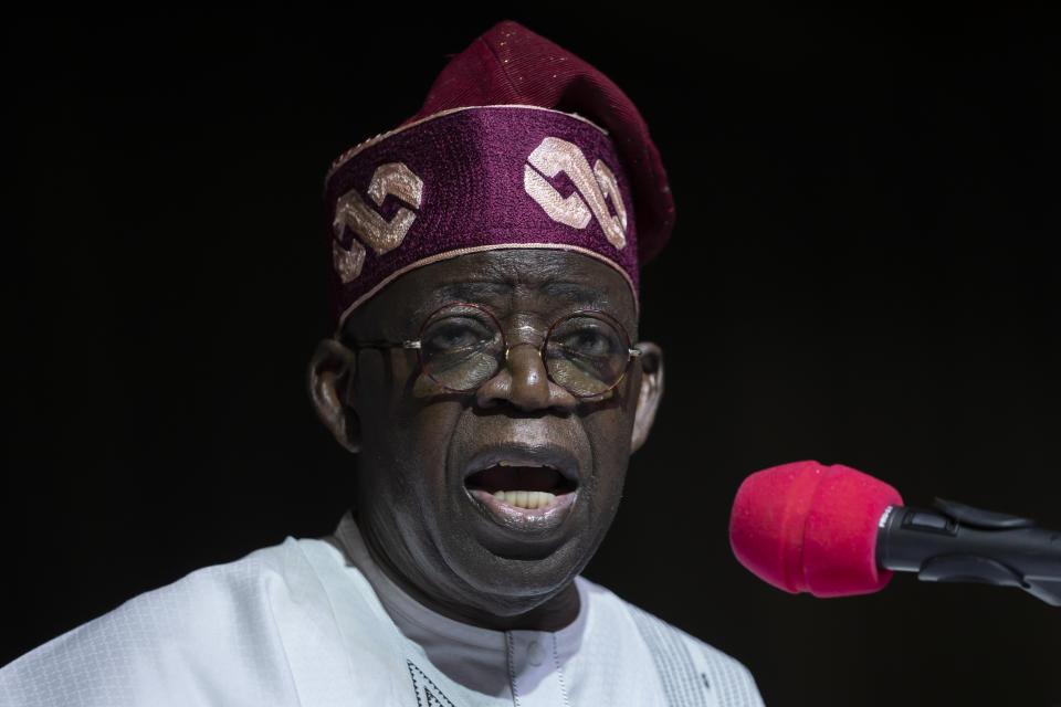 FILE- President-Elect Bola Tinubu addresses gathered supporters and the country after receiving his certificate at a ceremony in Abuja, Nigeria Wednesday, March 1, 2023. Nigeria's Bola Tinubu will take over the reins in Africa's most populous country at a period of unprecedented challenges, leaving some citizens hopeful for a better life and others sceptical that his government would perform better than the outgoing one on Monday May 29, 2023. (AP Photo/Ben Curtis, File)