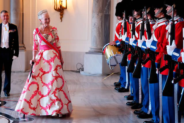 <p>LISELOTTE SABROE/Ritzau Scanpix/AFP via Getty</p> Queen Margrethe inspects a Guard of Honor ahead of the dinner at Amalienborg Castle in Copenhagen, on June 15, 2023.