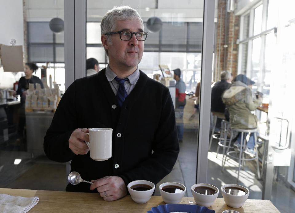 n this photo taken Thursday, Jan. 3, 2013, James Freeman, founder of Blue Bottle Coffee poses after cupping samples of coffee at his roastery in Oakland, Calif. (AP Photo/Eric Risberg)