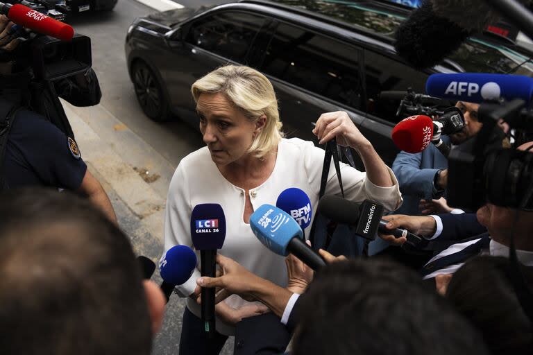 Marine Le Pen, leader of the French far-right, arrives at the headquarters of the National Rally party in Paris.