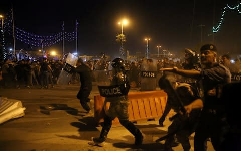 Iraqi security forces reportedly fired warning shots as protesters threatened to storm more public buildings - Credit: ABDULLAH DHIAA AL-DEEN/REUTERS