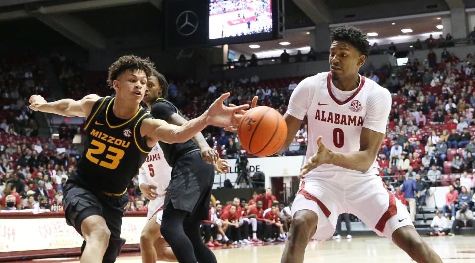 Missouri forward Trevon Brazile (23) bats the ball away from Alabama forward Noah Gurley (0) in Coleman Coliseum Saturday, Jan. 22, 2022. 