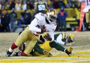 Jan 5, 2014; Green Bay, WI, USA; San Francisco 49ers tight end Vernon Davis (85) makes a touchdown catch against Green Bay Packers strong safety Morgan Burnett (42) and inside linebacker A.J. Hawk (50)during the second haf of the 2013 NFC wild card playoff football game at Lambeau Field. Mandatory Credit: Mike DiNovo-USA TODAY Sports