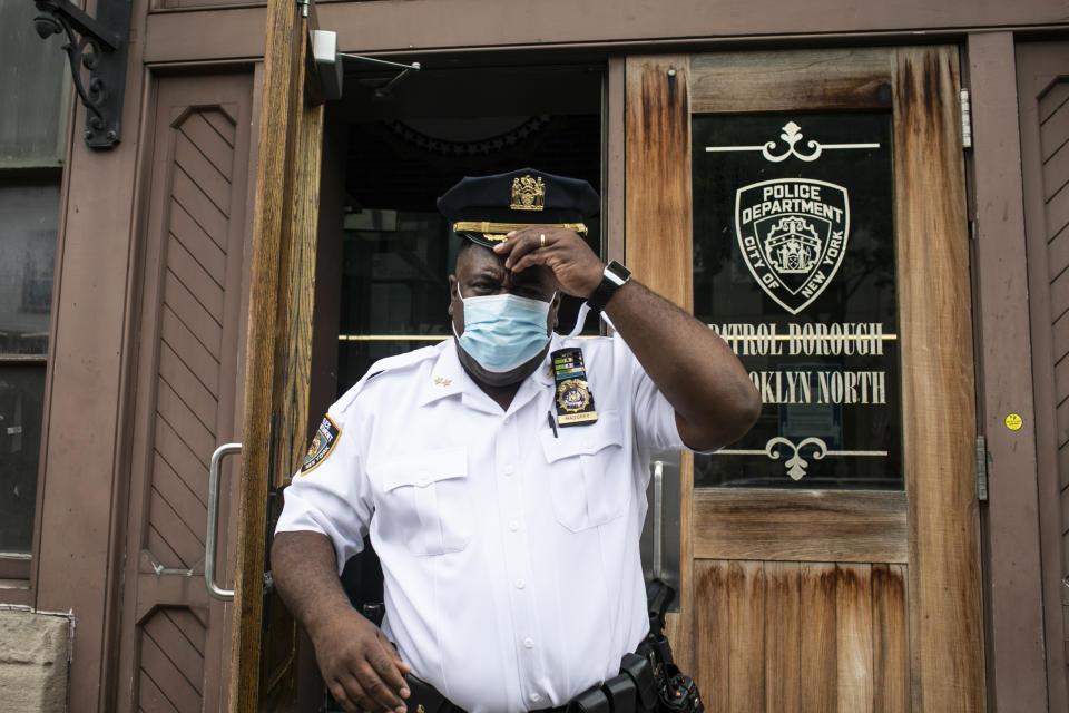 FILE - In this June 11, 2020, file photo Assistant Chief Jeff Maddrey, leaves the Brooklyn North Patrol Borough in the Brooklyn borough of New York. “You know, being a Black man, being a police officer and which I’m proud of being, both very proud — I understand what the community’s coming from,” said Maddrey, an NYPD chief in Brooklyn and one of many officers who took a knee during protests. (AP Photo/Wong Maye-E, File)