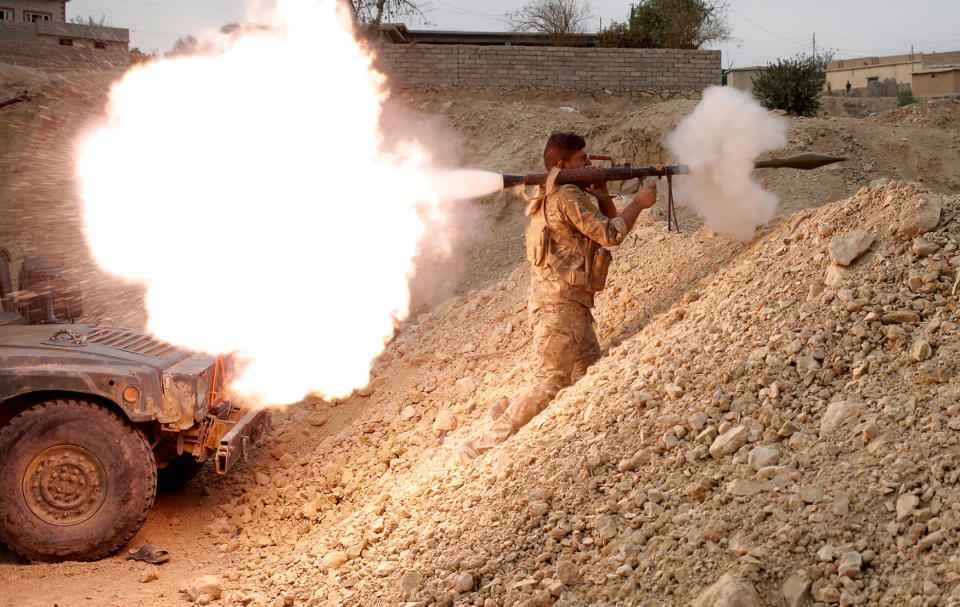 An Iraqi soldier fires a RPG in Karamah, south of Mosul