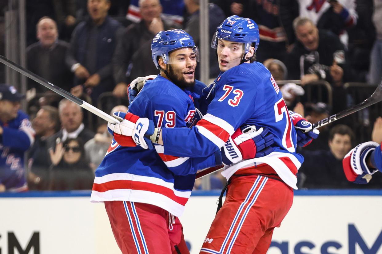 Apr 21, 2024; New York, New York, USA; New York Rangers center Matt Rempe (73) celebrates with defenseman K'Andre Miller (79) after scoring a goal in the second period against the Washington Capitals in game one of the first round of the 2024 Stanley Cup Playoffs at Madison Square Garden.