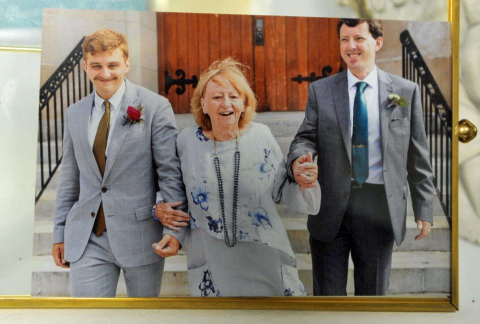 One of Kate O'Sullivan's favorite photos that she keeps in her office shows her with her two godsons and nephews at the wedding of one of them in Quincy in 2020. The groom is Ian Macadam, of Quincy, right. His cousin Liam Hurley, of South Boston, is on the left.