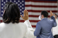 FILE- In this July 2, 2020, file photo, people take the oath of citizenship during a naturalization ceremony at U.S. Citizenship and Immigration Service's Field Office in New York. Immigrant rights activists energized by a new Democratic administration and majorities on Capitol Hill are gearing up for a fresh political battle. A coalition of national advocacy groups on Monday announced a multimillion-dollar campaign to help push through President Joe Biden’s plan to open a citizenship pathway for up to 11 million people. (AP Photo/Frank Franklin II, File)