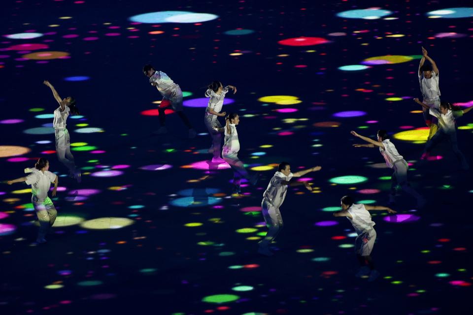 Performers dance during the opening ceremony of the Olympic Games.