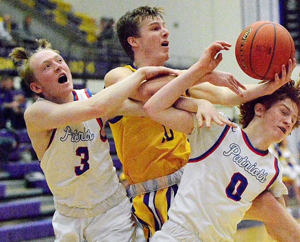 Watertown's Kohen Kranz (center) battles for a rebound with Douglas' Jacob Blaisure and Isaiah Brewer during a high school basketball doubleheader on Friday, Jan. 27, 2023 in the Watertown Civic Arena.