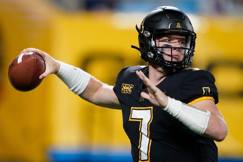 Appalachian State quarterback Chase Brice looks for a receiver during the second half against East Carolina in an NCAA college football game Thursday, Sept. 2, 2021, in Charlotte, N.C. (AP Photo/Chris Carlson)